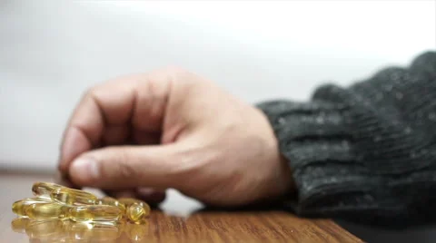 Committing suicide with pills Stock Footage 58953016