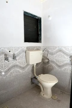 A commode in a bathroom Stock Photos