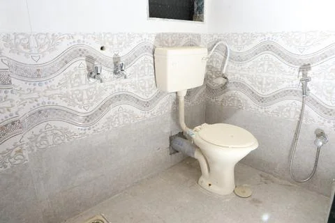 A commode in a bathroom Stock Photos