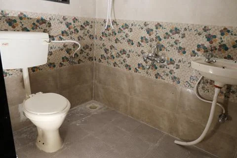 A commode in a bathroom Stock Photos