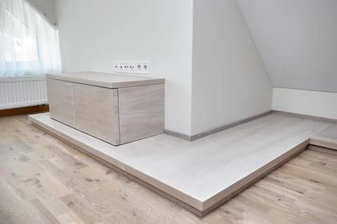 Commode for TV set of white oak lumber on a wooden podium Stock-Fotos