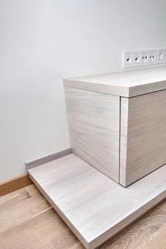Commode for TV set of white oak lumber on a wooden podium close up 写真素材
