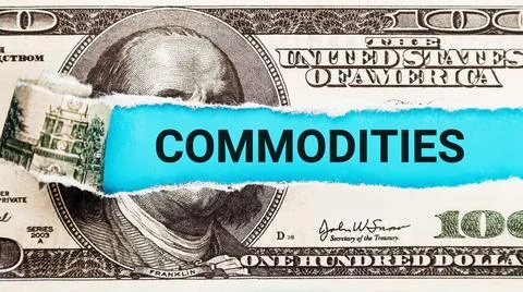 Commodities. The word Commodities in the background of the US dollar. Trading an Stock Photos