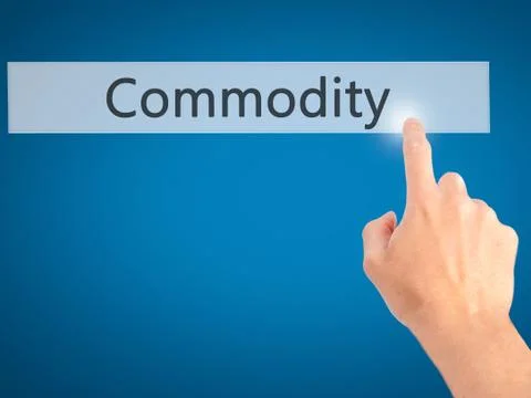 Commodity - Hand pressing a button on blurred background concept on visual sc Stock Photos