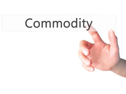 Commodity - Hand pressing a button on blurred background concept on visual sc Stock Photos