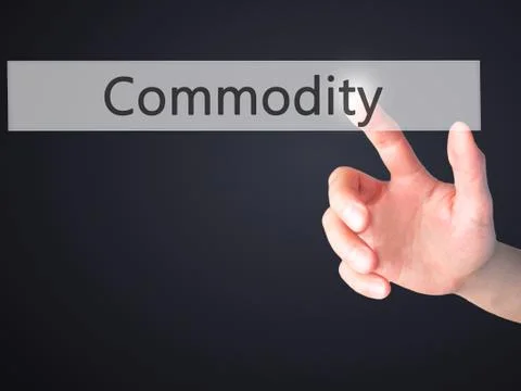 Commodity - Hand pressing a button on blurred background concept on visual sc Stock Photos