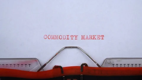 Commodity market - phrase printed on an old typewriter in red letters, close up. Stock Footage 129534902