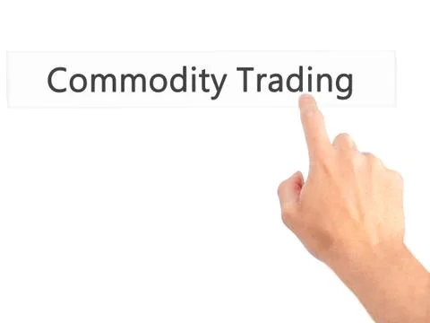 Commodity Trading - Hand pressing a button on blurred background concept . Bu Stock Photos