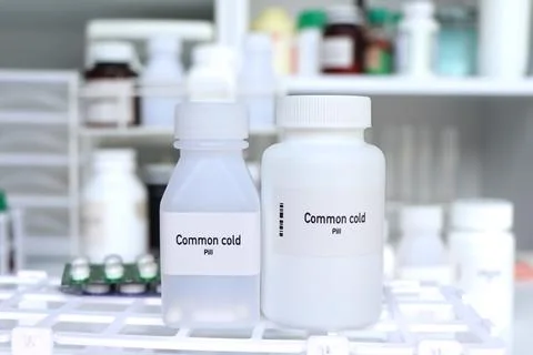 Common cold pill in white bottle, pill stock Stock Photos