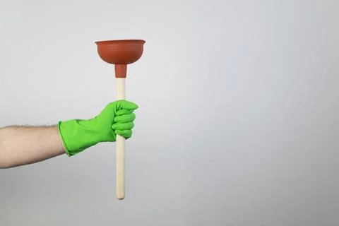 Common drain issues, hand hold plunger, plumbing sewer pipe Stock Photos