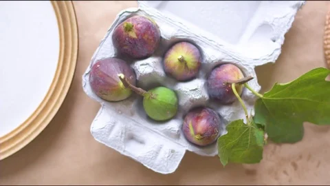 Common figs on cartons Stock Footage 76136155