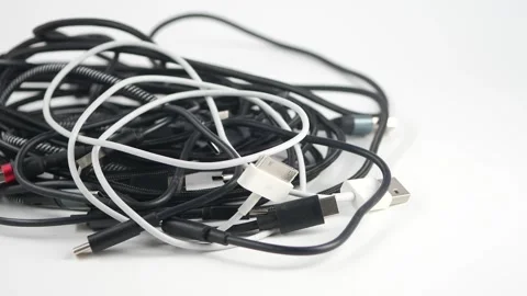 Common types of charging cables in messy pile Stock Footage 329083251