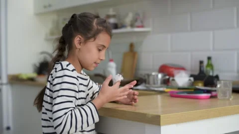 Common white hamster held in the hand of a happy little girl. Stock Footage 140282582