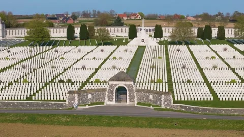 Commonwealth war cemetery tyne cot aerial symmetrical view white wwi headstones Stock Footage 341739861