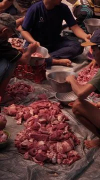 Communal Meat Distribution Stock Photos