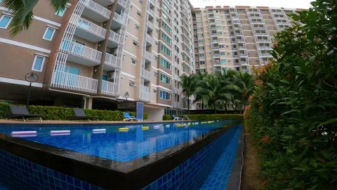 Communal pool in the yard of a condominium in the tropics Stock Footage 171910233