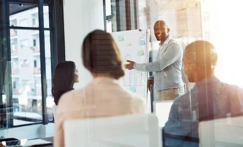 Communicating a bold, specific, and consistent vision. A businessman giving a Stock Photos