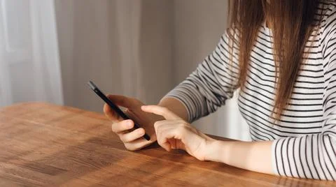 Communicating via the Internet on a smartphone. the concept of using technology Stock Photos