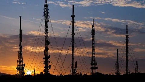 Communication Antennas: Time Lapse at Sunrise with Colorful Clouds Stock Footage 129177544