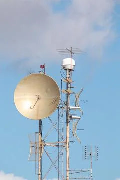 A communication array on a building mast Stock Photos