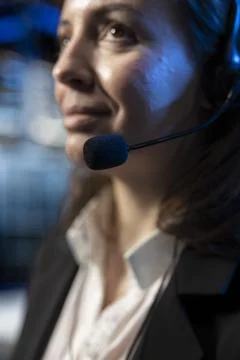 Communication with b2b clients, headset mic closeup, tech support in data center Stock Photos