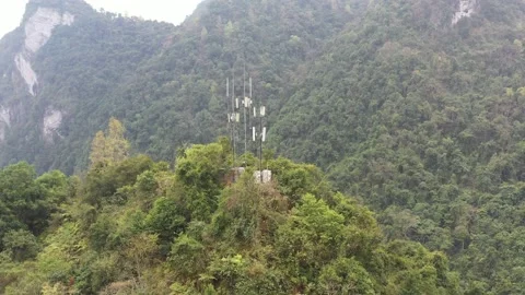 Communication base stations and antennas on a mountain top in karst terrain Video stock 234181137