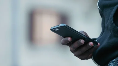 Communication, business, devices- african man's hand typing on smartphone Stock Footage 92692123