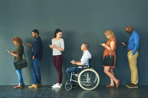 Communication comes in many forms. a group of people standing in a row behind Stock Photos