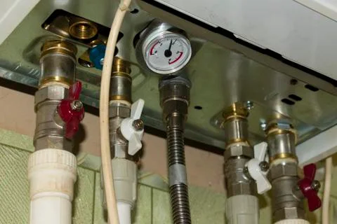 Communication with cranes and pressure sensor connected to the heating boiler Stock Photos