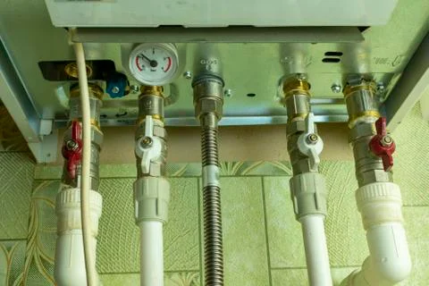 Communication with cranes and pressure sensor connected to the heating boiler Stock Photos