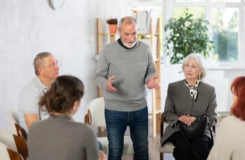 Communication of elderly people. Training and group therapy with psychologist Stock Photos
