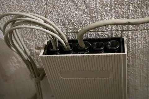 Communication hub with connected network cables. Stock Photos