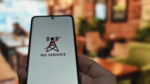 Communication issues concept with a smartphone displaying a no service error Stock Footage 340510054