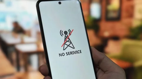 Communication issues concept with a smartphone displaying a no service error Stock Footage 340510057