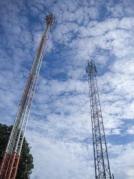 Communication pole with blue sky background Stock Photos