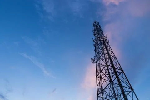 Communication poles on evening Stock Photos