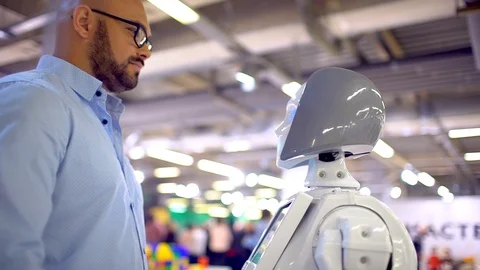Communication robot and human. a man hugs a woman robot. Modern Robotic Stock Footage 86451315