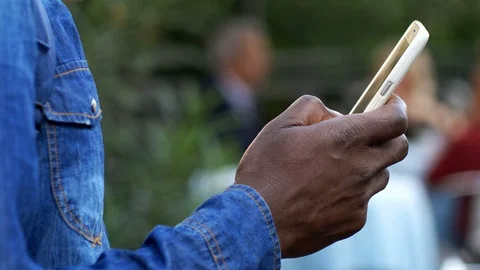 Communication, technology black man hand typing on smartphone- close up Stock Footage 91072377