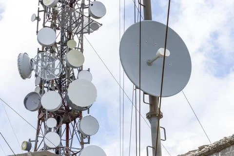 Communication tower antennas beaming network signals Stock Photos