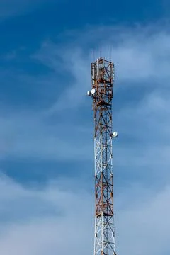 Communication tower on the background of the sky Stock Photos