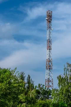 Communication tower on the background of the sky Stock Photos
