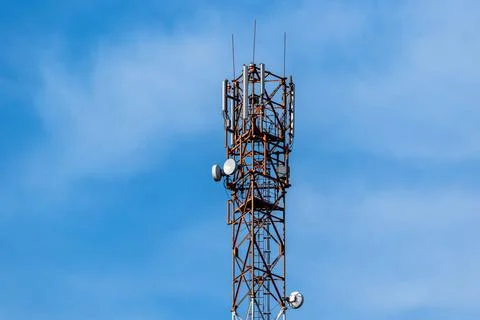 Communication tower on the background of the sky Stock Photos