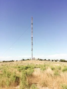 Communication tower on a blue sky background Stock Photos