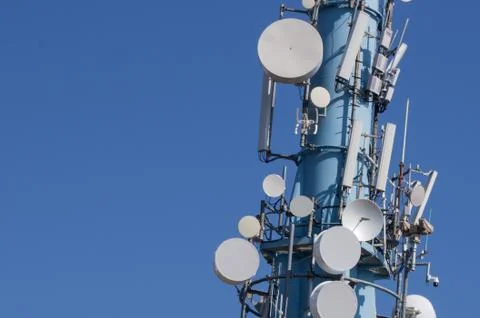 Communication tower in cloudless sky Stock Photos