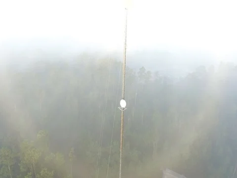 COMMUNICATION TOWER IN THE FOG Stockbeeldmateriaal 70432647