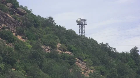 Communication Tower On Forest Hillside Mountain Dramatic Handheld 4K Stock Footage 44743385