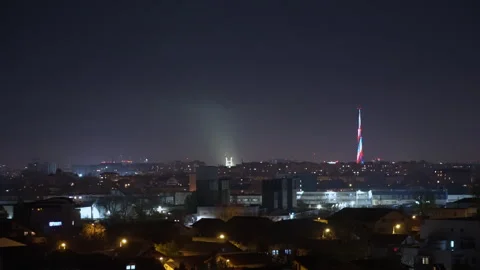 Communication tower with led light on city skyline for Christmas season Stock Footage 258160656