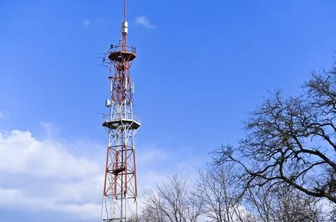 Communication tower with metal framework painted red and white, Stock Photos