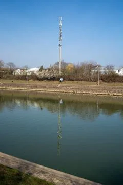 Communication tower reflected in water Stock Photos