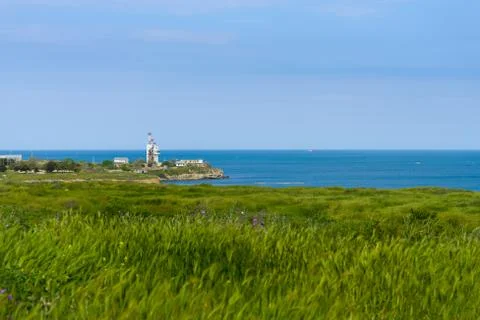 Communication tower by the sea Stock Photos